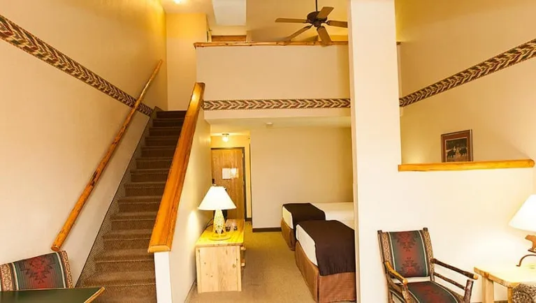 The stairs and living area in the Loft Fireplace Suite (Balcony/Patio)
